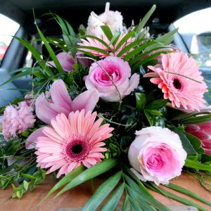 closeup shot of a colorful casket in a hearse or chapel before funeral or burial at cemetery